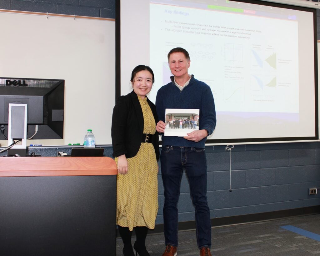 Dr. Lan Li presenting a token of appreciation to Dr. Bill Knowlton.