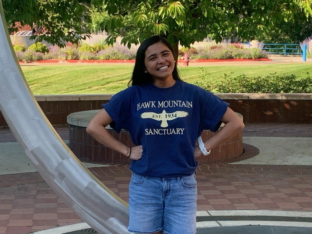 M.S. Raptor Biology Graduate Patricia Dumandan posing outside
