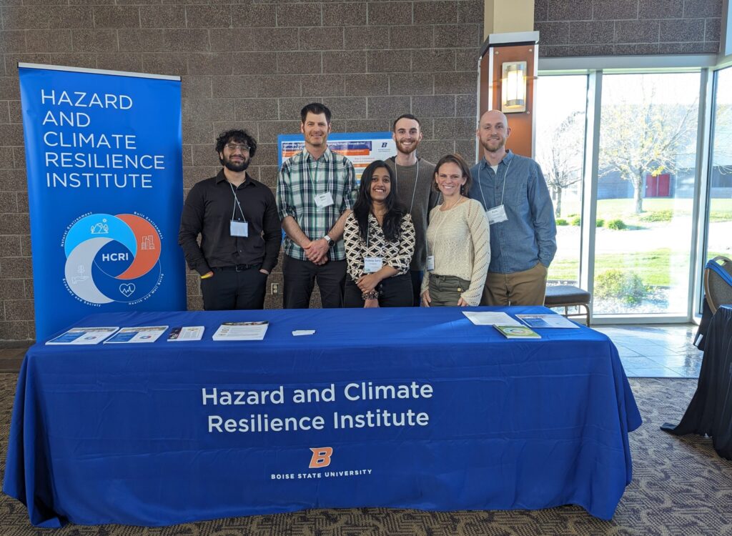 HCRI Group standing behind conference table