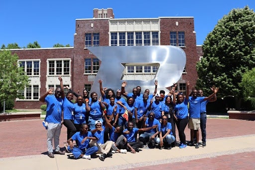 Mandela Fellows in front of b statue
