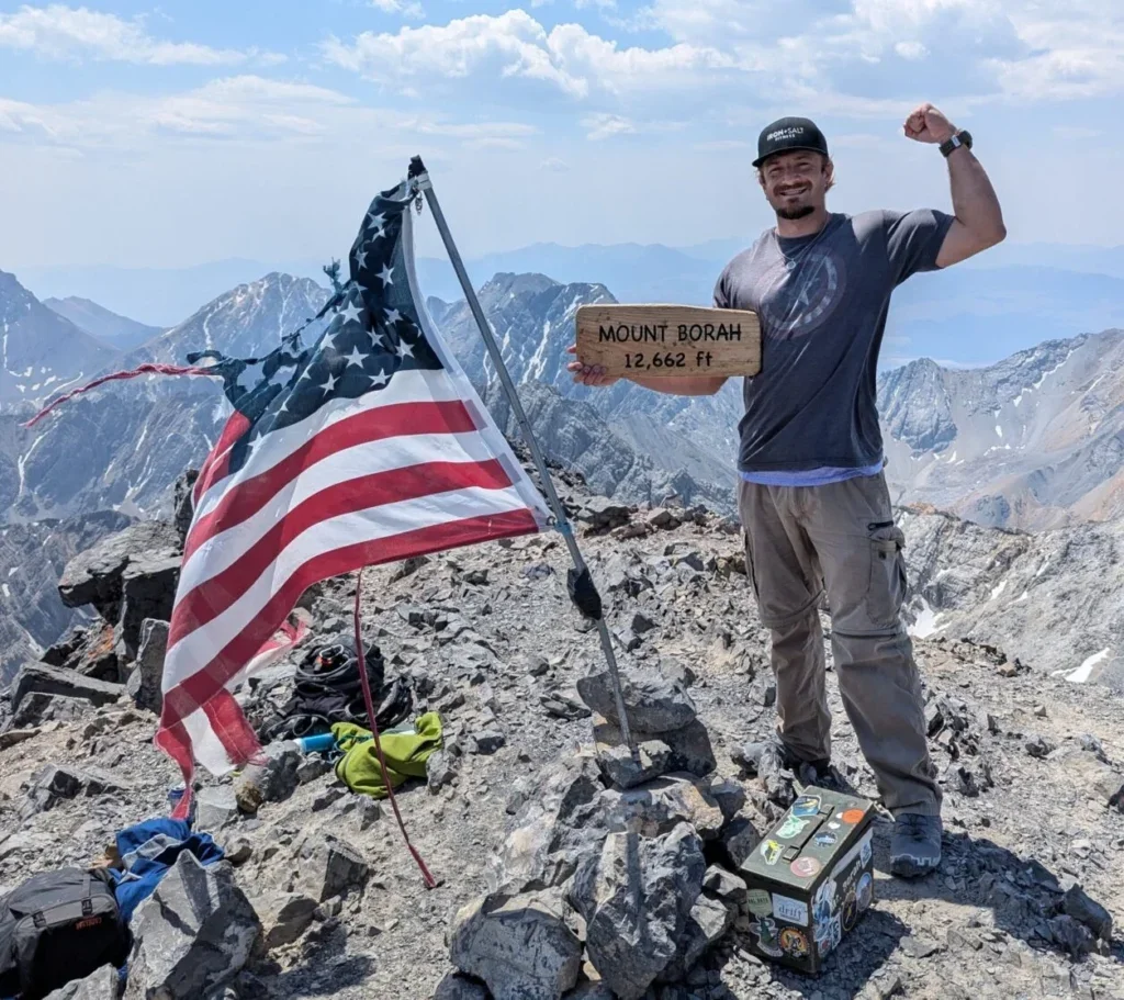 Brennan standing on top of Mount Borah
