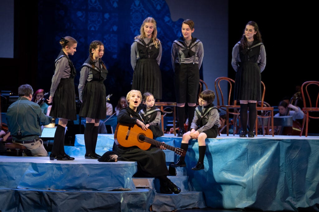 Performers rehearsing on stage