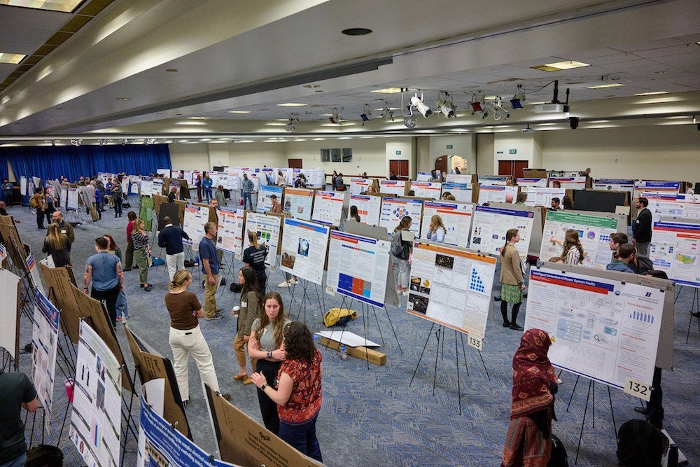 students presenting work at the Graduate research showcase