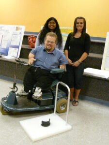students developing adaptive devices for persons with disabilities