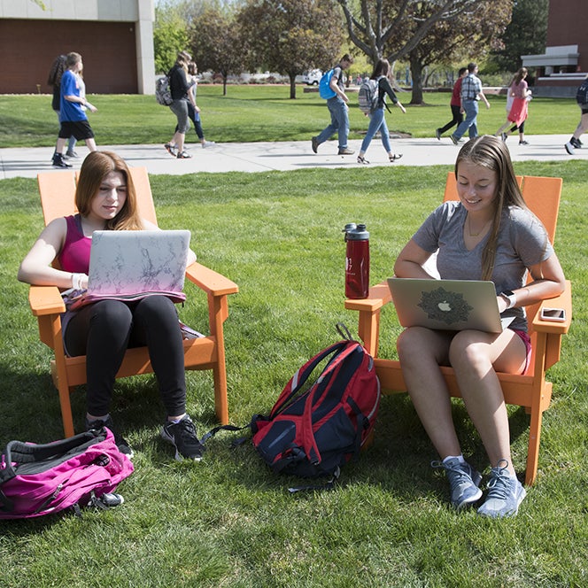 Freshmen Alma Ceja and Danielle Doerflein study on the quad between classes, photo Patrick Sweeney