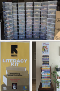 Stacks of boxes and totes of the literacy kits, and a pile of books that went into them.