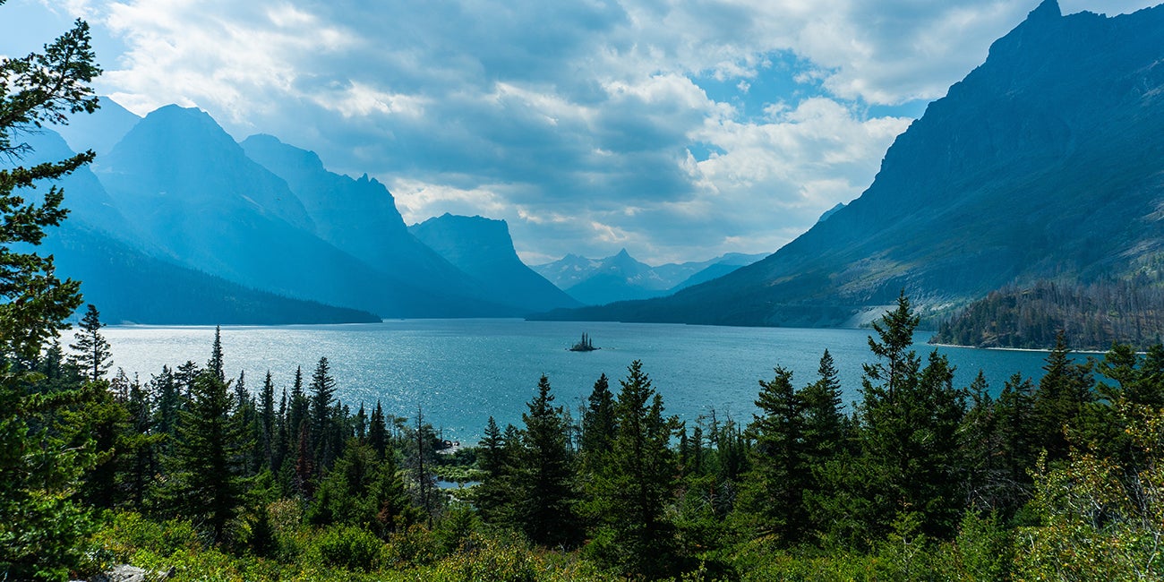 Landscape photograph of a lake surrounded by mountains