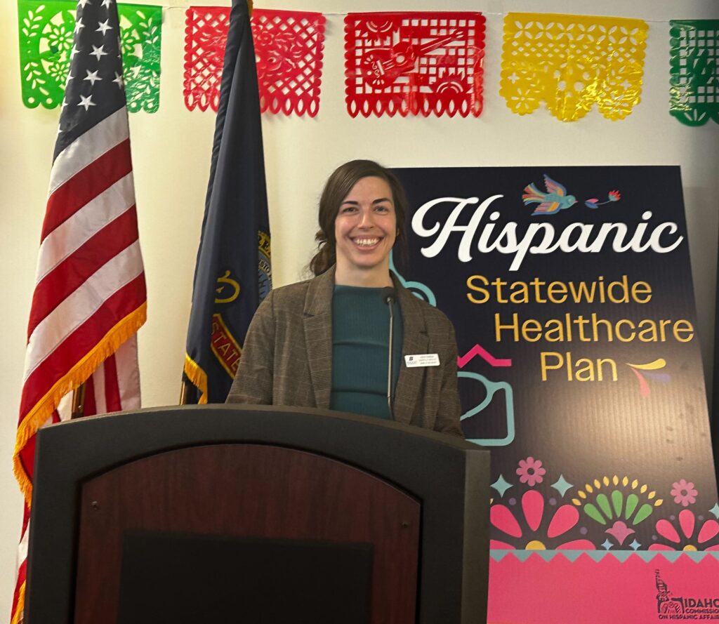 Maria Onaindia presents findings at a legislative session with the Idaho Commission on Hispanic Affairs.