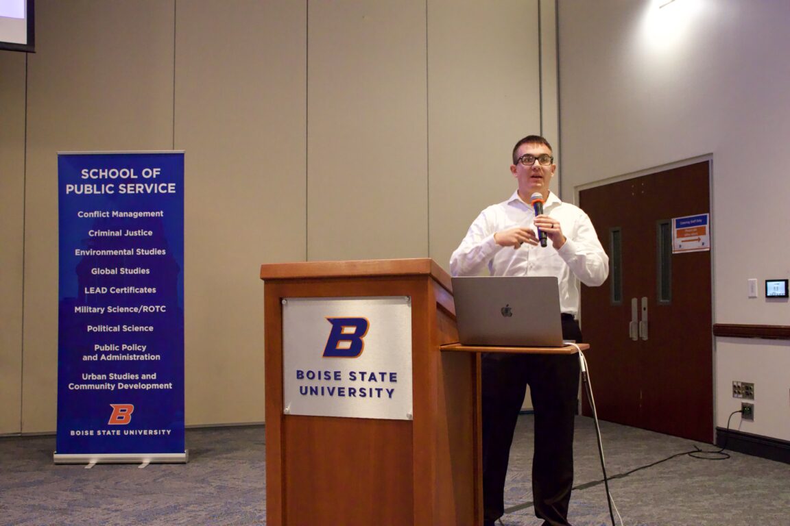 Damien Peinitz giving a speech at a podium