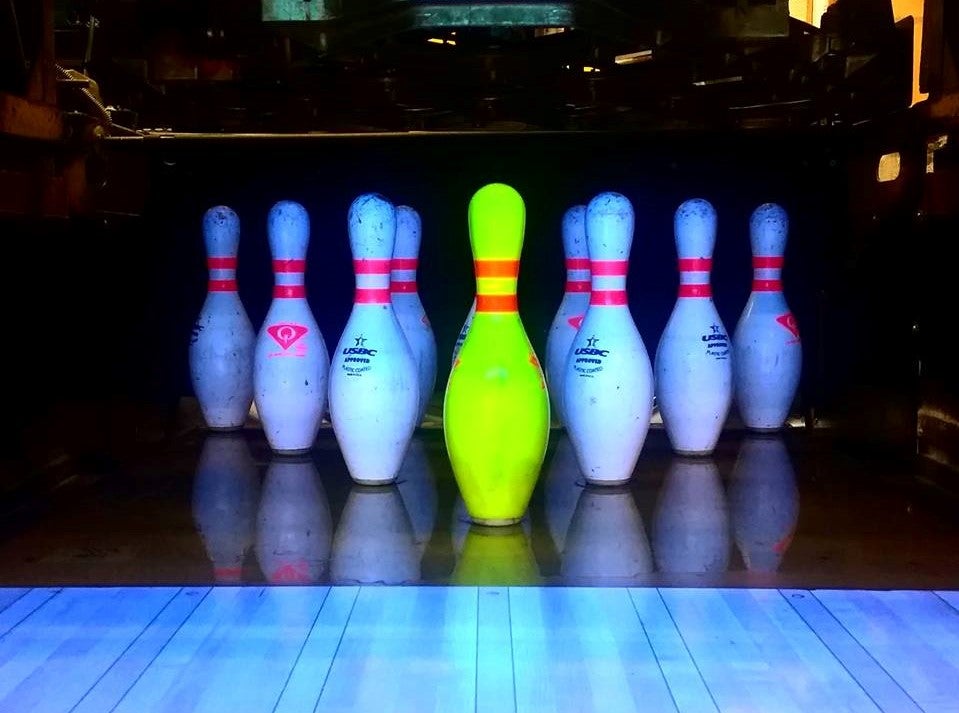 bowling pins under blacklight