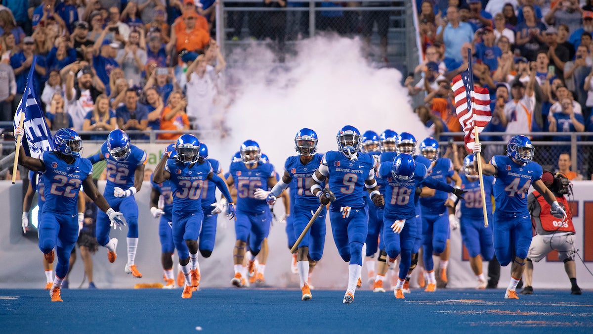 Football team running onto the field
