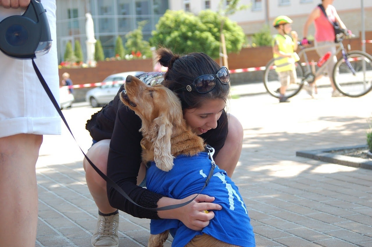 Girl hugging a dog