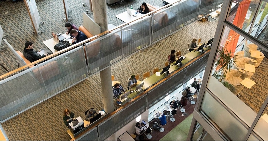 Scene on campus of students studying