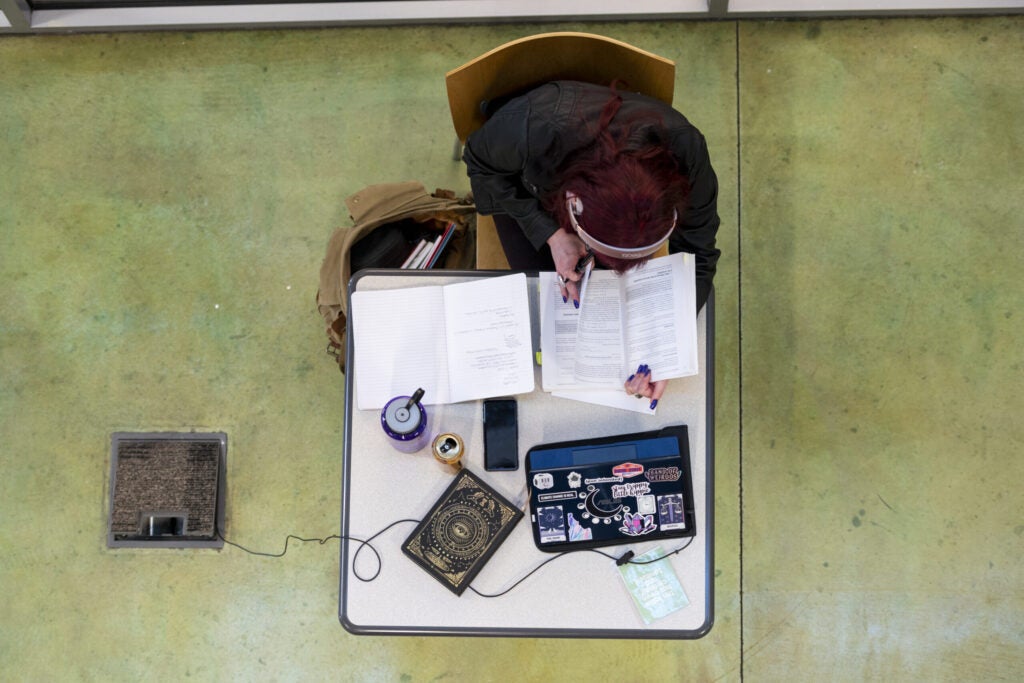 A student studying with headphones.