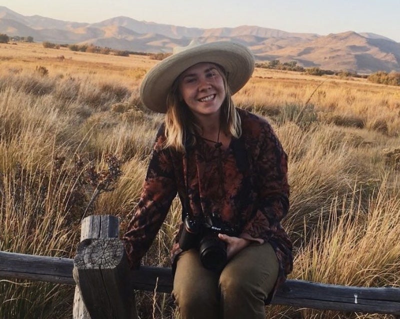 Abbey Nimegeers holding a camera.