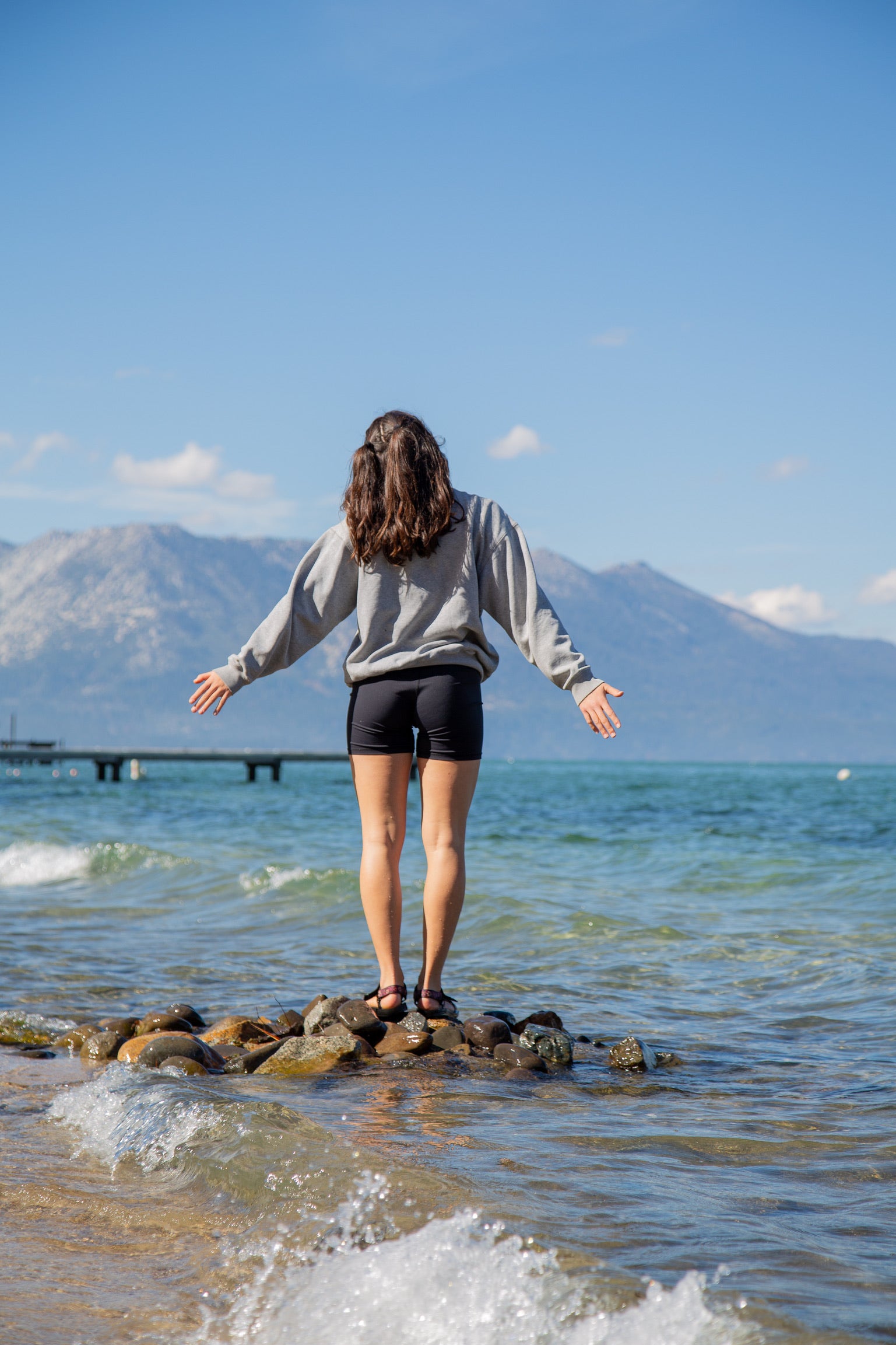 Standing on the shore of a mountain lake