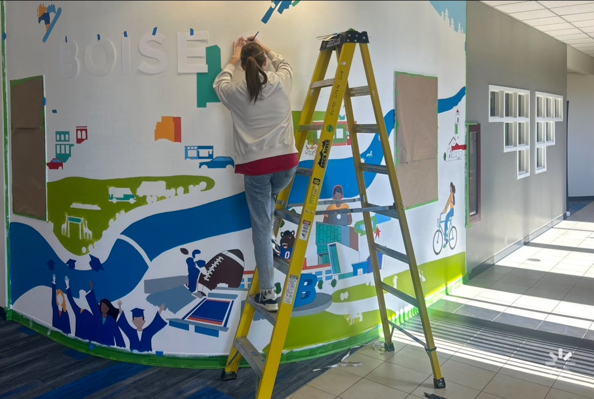 Hailee working on a mural