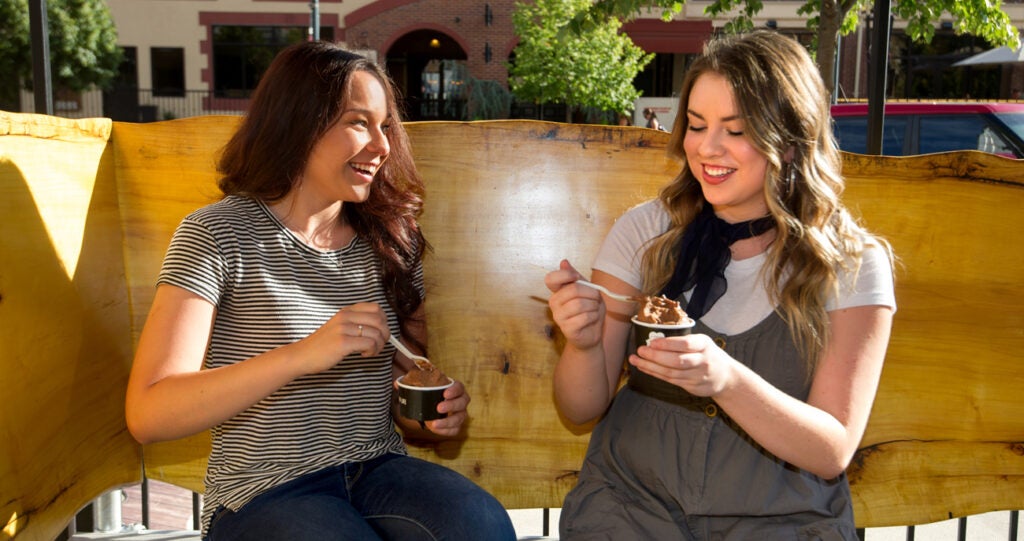 Two students eating ice cream.
