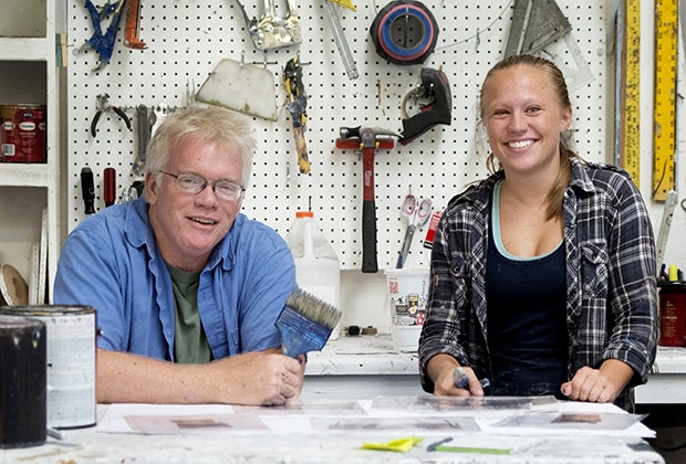 Man and woman in tool workshop