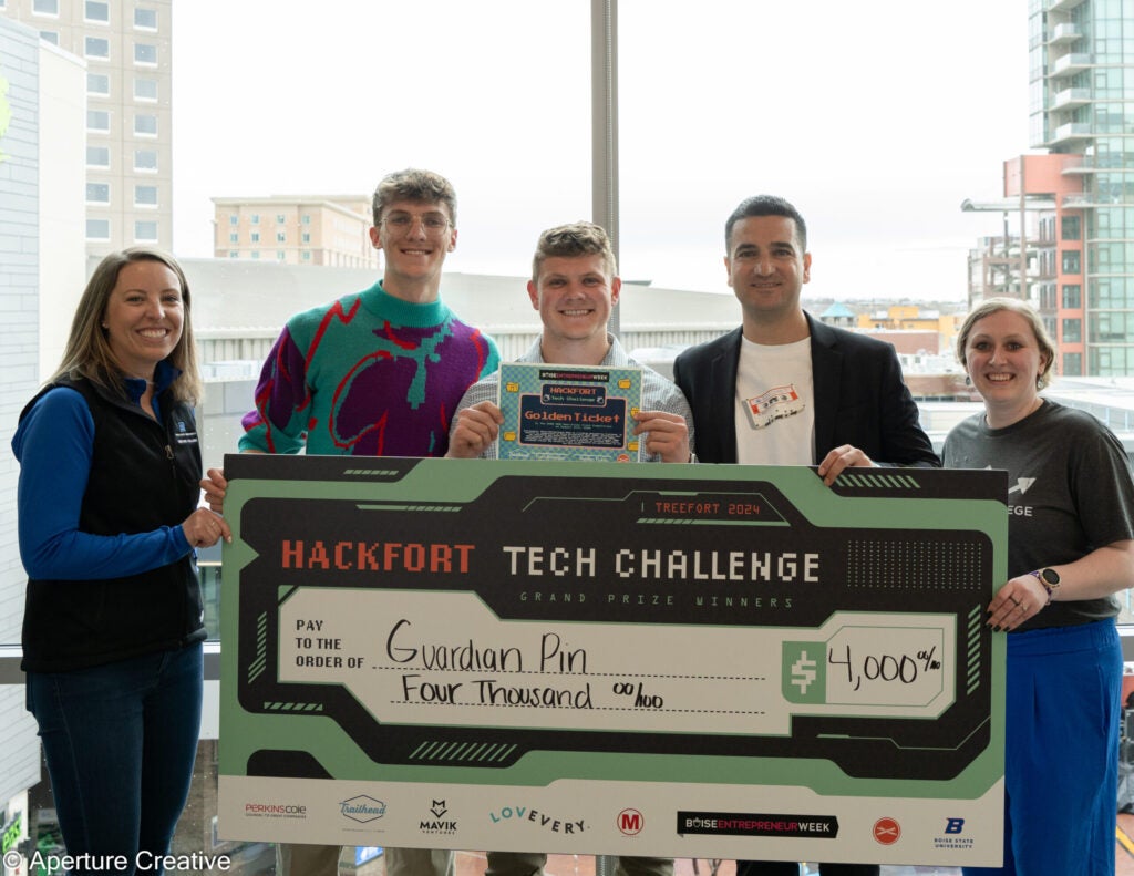 Hackfort Tech Challenge Winner Jacob Stubbers with Check and Boise Entrepreneur Week Golden Ticket pictured with Venture College and Trailhead Staff