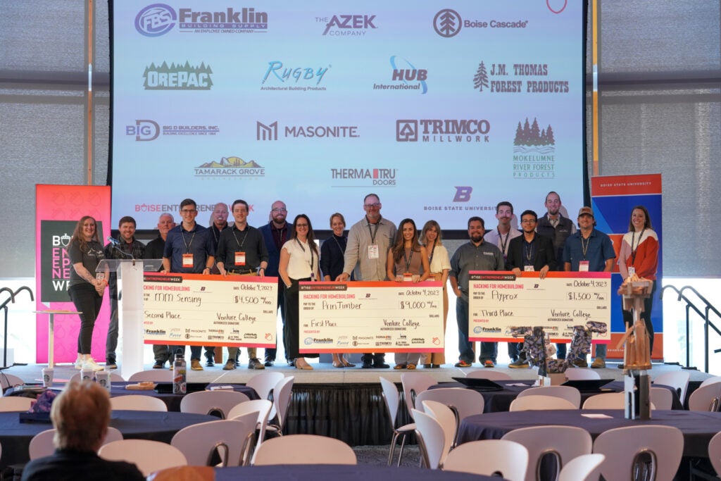 2023 Hacking For Home For Homebuiliding Competition Judges Finalists Sponsors on stage with checks