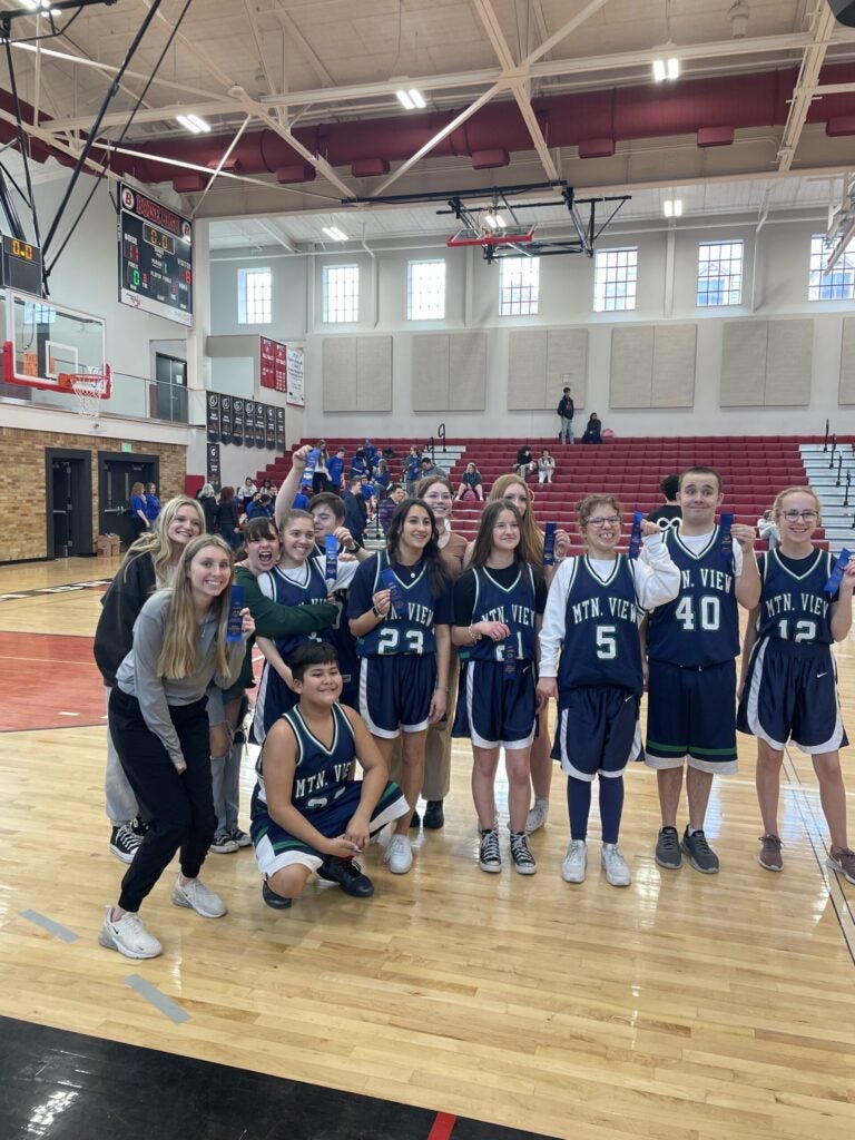 Emma with basketball players