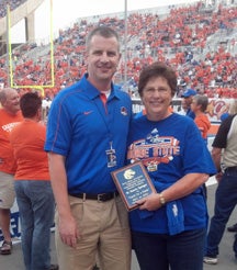 coach-springer Assistant Athletic Director for Academic Services Gabe Rosenvall with Pam Springer, associate dean of the College of Health Sciences and director of the School of Nursing
