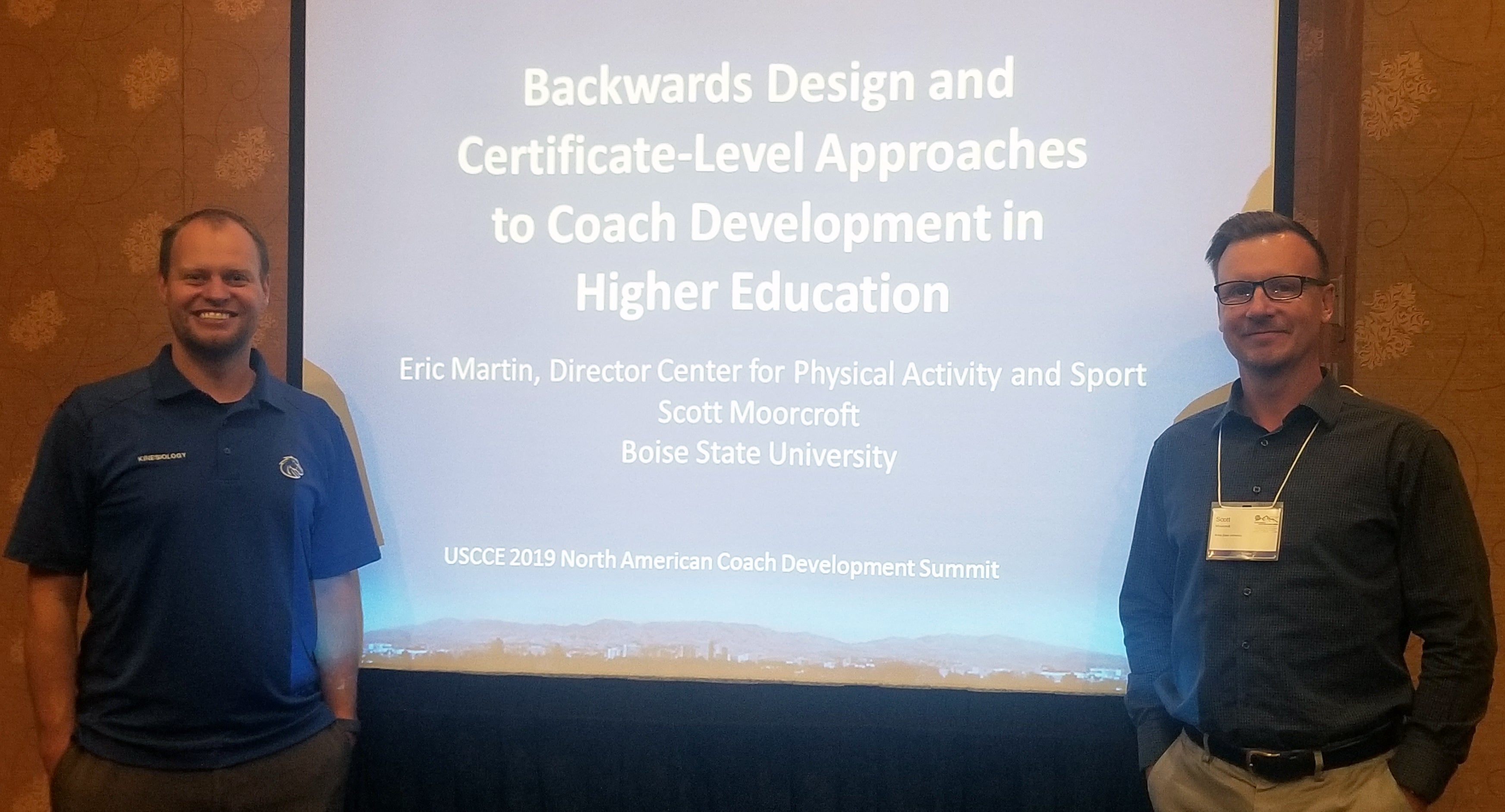 Scott and Eric stnading infront of their presentation