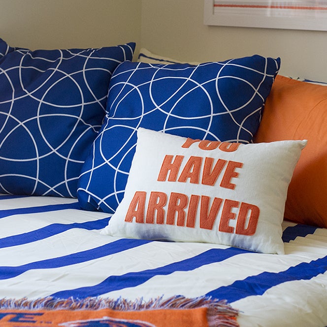 A pillow with "you have arrived" text