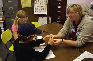 wireants student helping kids make wire ants