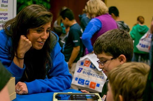 Teacher interacting with elementary students