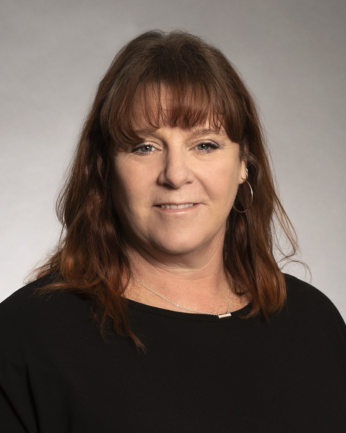 Headshot of Sherena Huntsman a middle aged white woman smiling